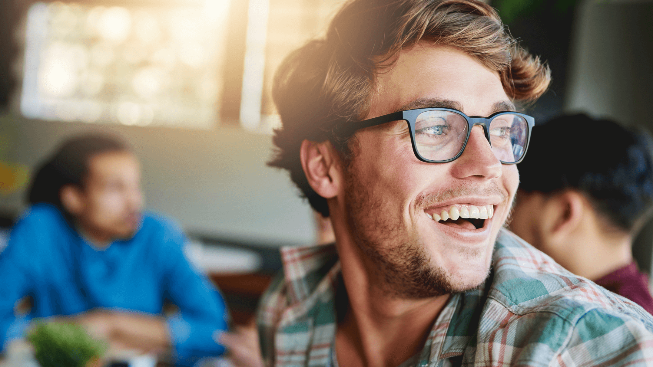 man with glasses on smiling